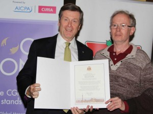 Eddie is presented with his certificate